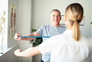 Chiropractician and Patient doing gymnastics