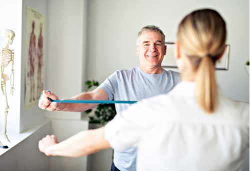 Chiropractician and Patient doing gymnastics
