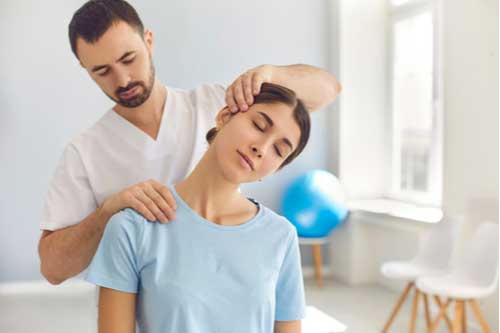 Picture with a chiropractician stretching the patient