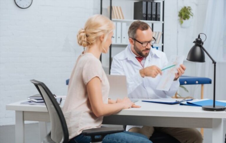 Female Patient Having Appointment at Chiropractic Clinic